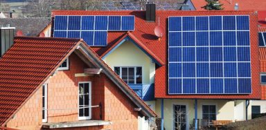 Houses with solar panels installed on the roof.