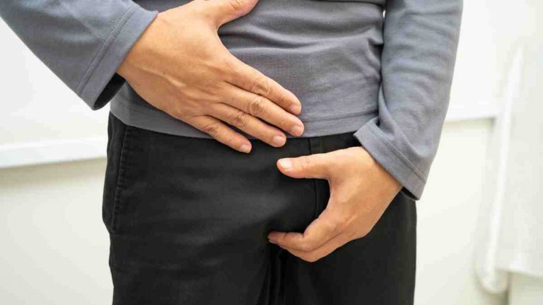 man suffering with hernia